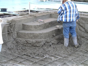 Setting the concrete framework for a new swimming pool and custom steps